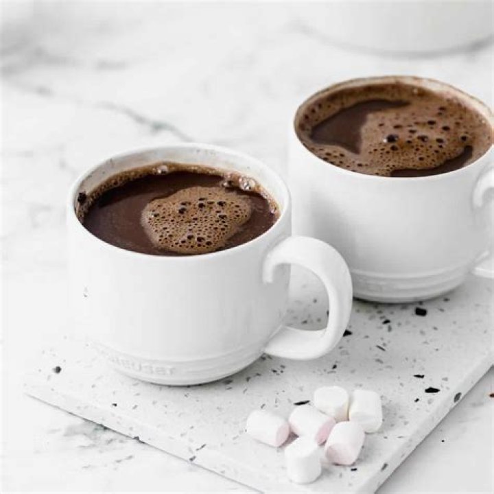 Should I make hot chocolate with milk or water?